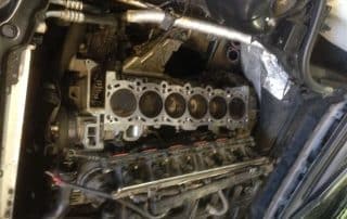 Exposed inline six-cylinder engine block in car