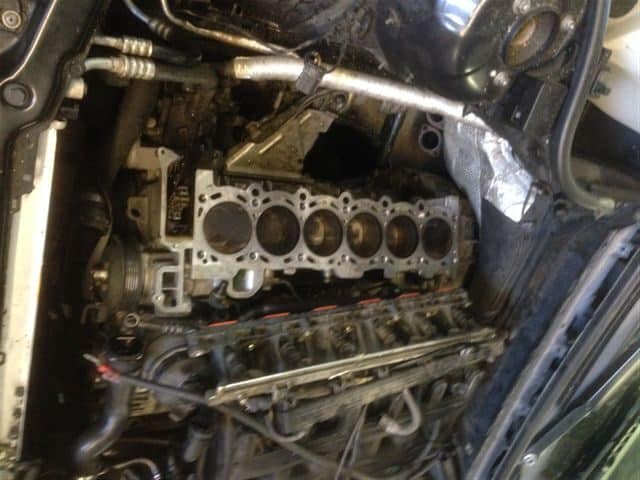 Exposed inline six-cylinder engine block in car