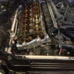 Car engine with exposed camshafts and timing chain