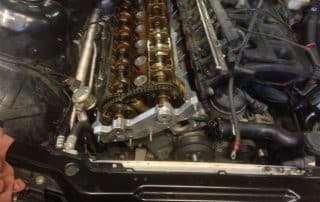 Car engine with exposed camshafts and timing chain