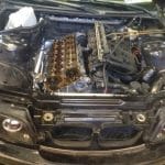 Car with hood open and exposed engine
