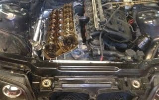 Car with hood open and exposed engine
