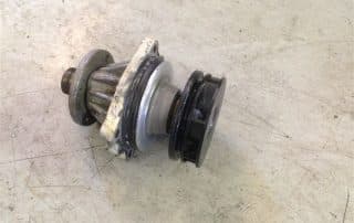 Automotive water pump component on workbench