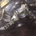 Close-up of car engine with serpentine belt