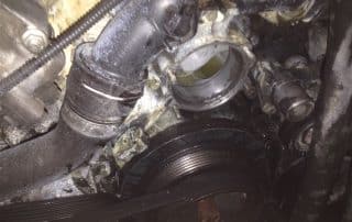 Car engine pulley and serpentine belt close-up