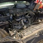 Car engine bay with exposed air intake system