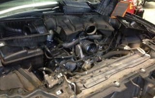 Car engine bay with air intake removed
