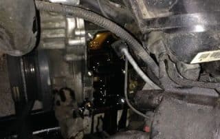 Car engine with visible oil leak