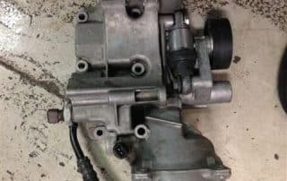 Automotive throttle body or carburetor on floor