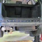 SUV rear on lift with bumper removed