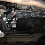 Car transmission with oil pan removed underneath vehicle