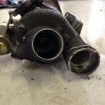 Used turbocharger on workshop floor