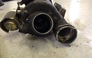 Used turbocharger on workshop floor