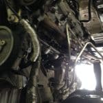 Underside of car with exposed engine components