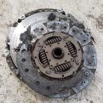 Severely worn and damaged car clutch disc
