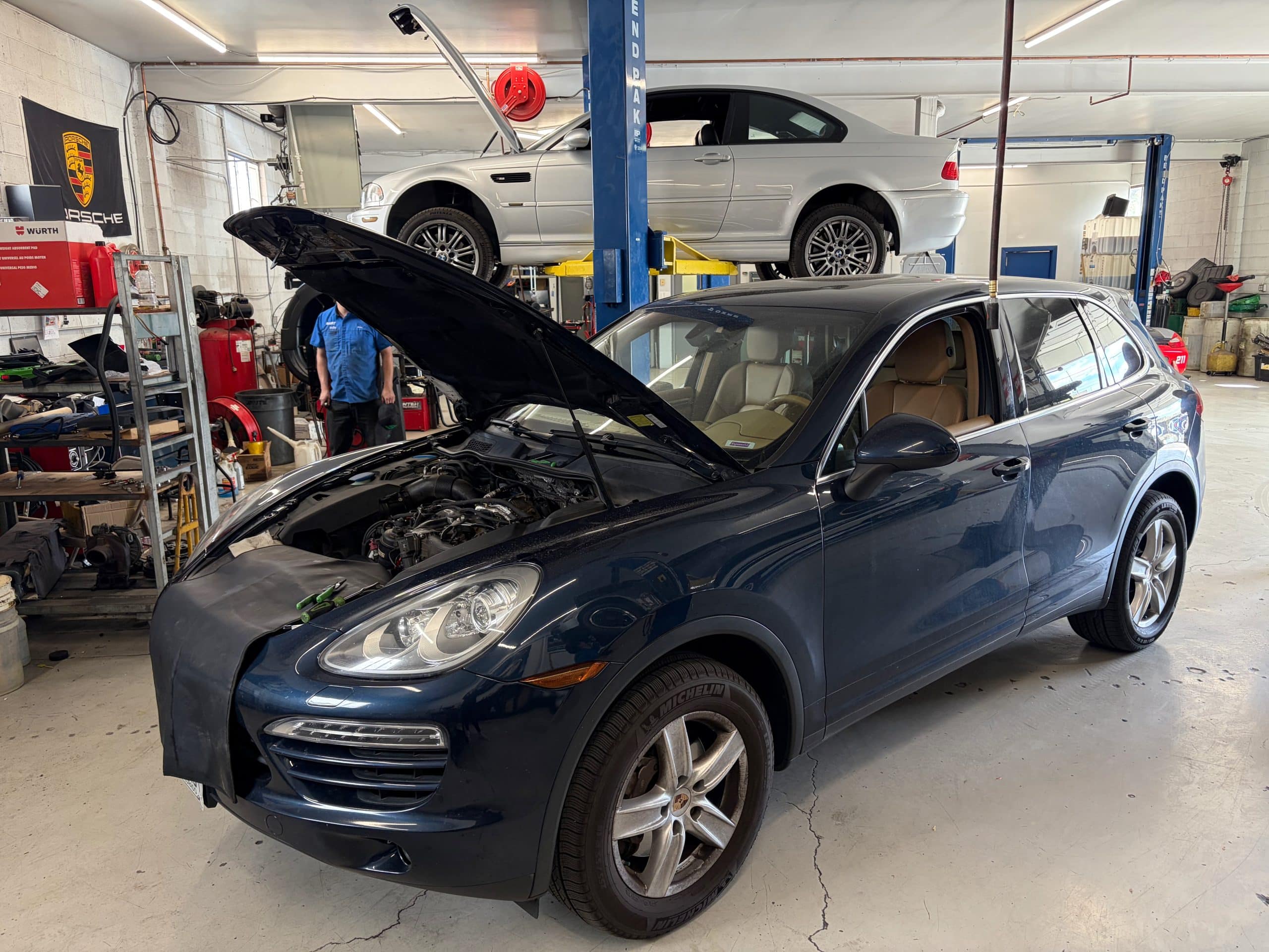 Porsche SUV in auto repair shop