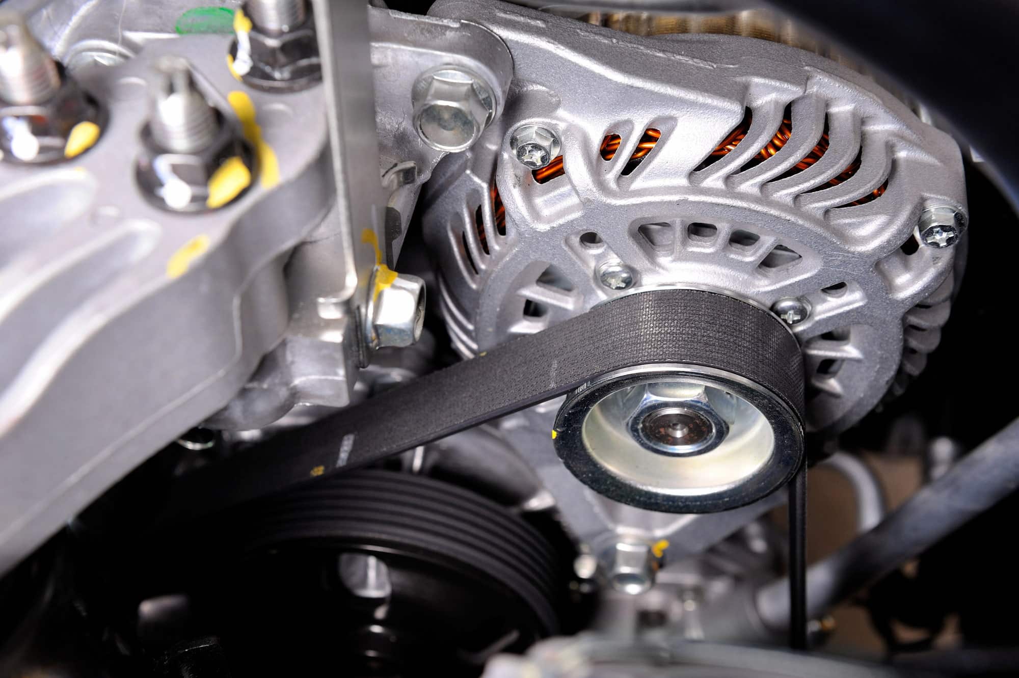 Car engine alternator with serpentine belt close-up