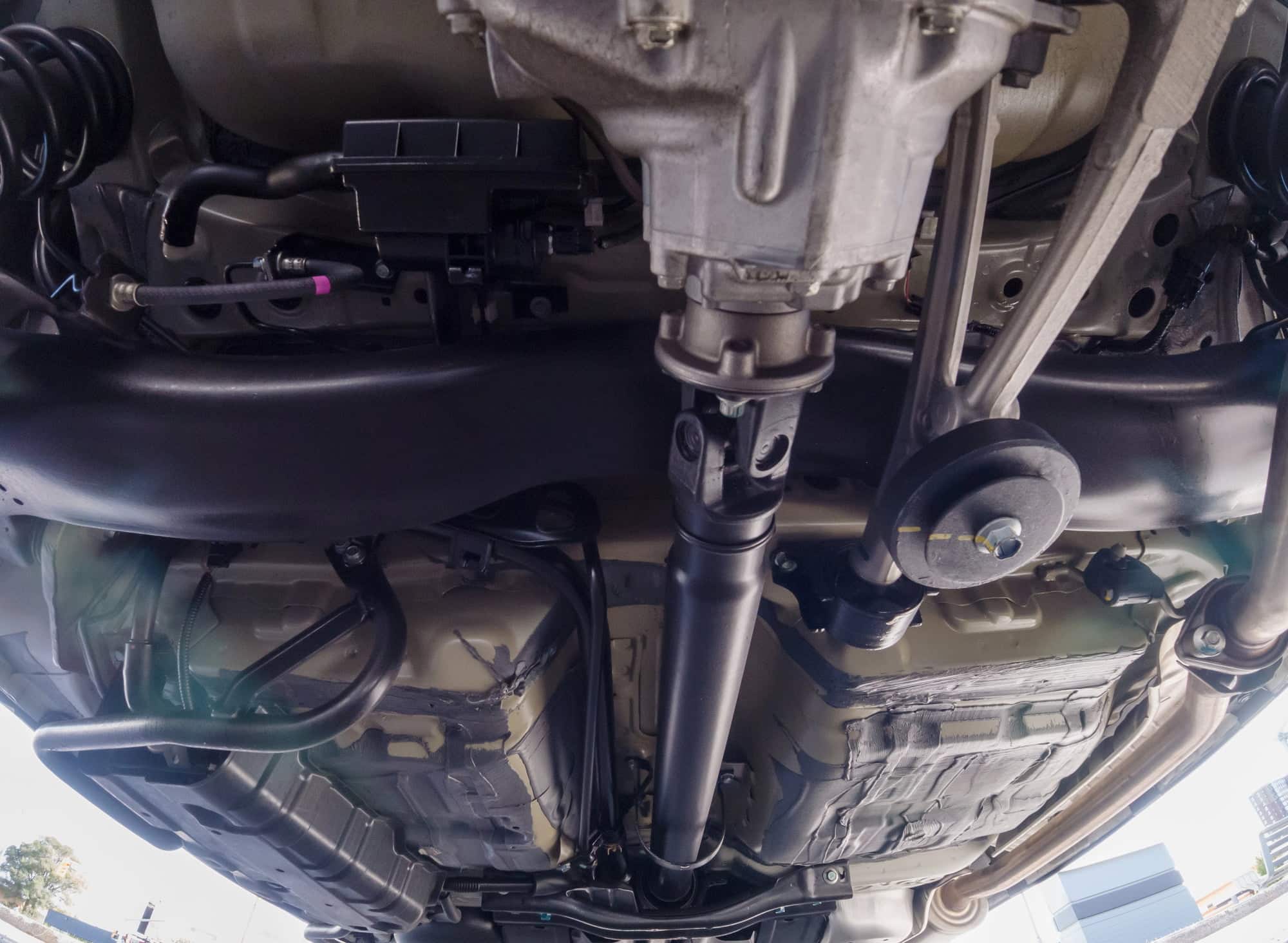 Undercarriage of vehicle showing suspension and exhaust system