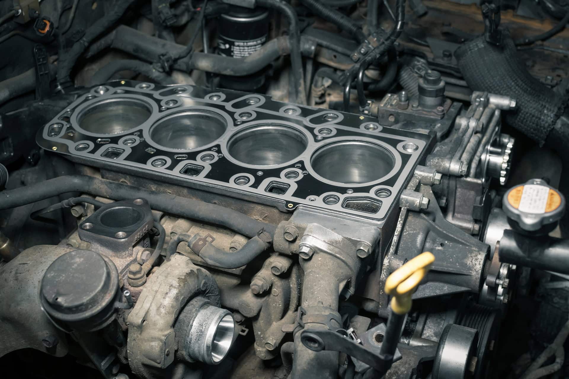 Car engine block with exposed cylinders and gasket