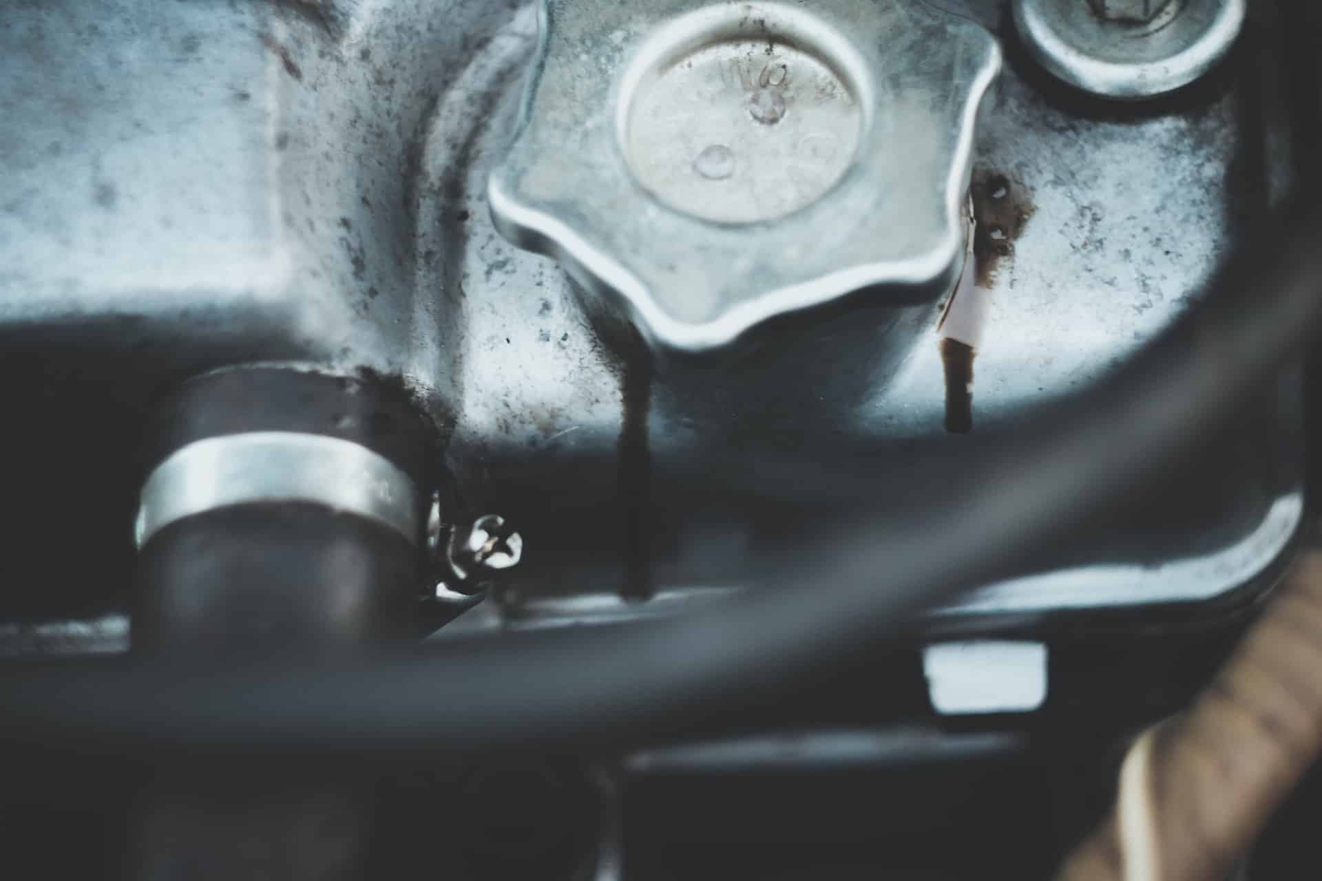 Close-up of engine with oil leak