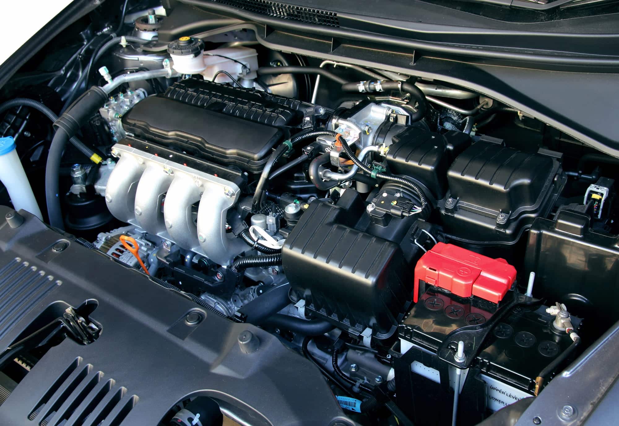 Car engine bay with battery and components