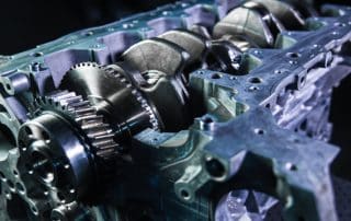 Close-up of engine block with crankshaft and gears