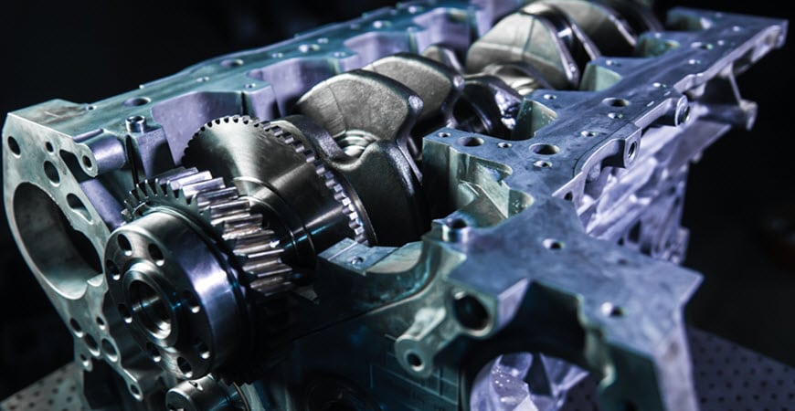 Close-up of engine block with crankshaft and gears