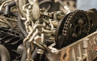 Close-up of car engine timing chain and gears
