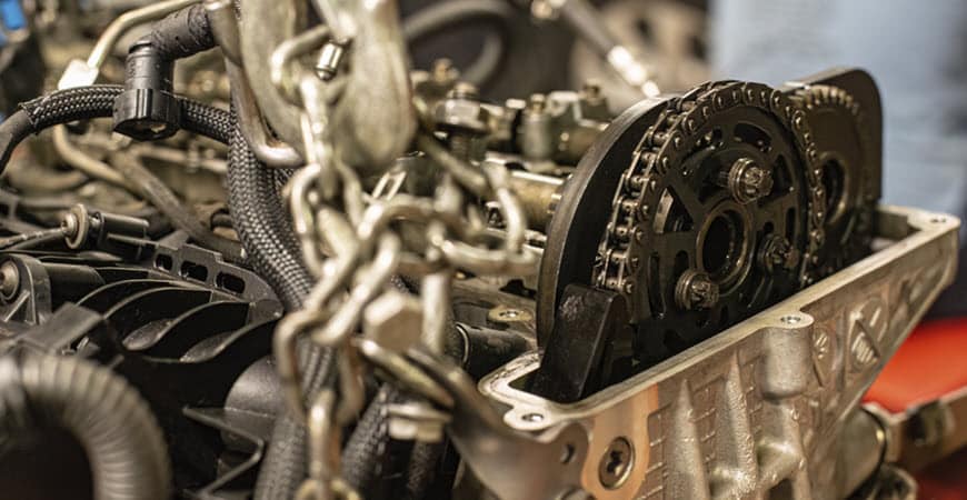 Close-up of car engine timing chain and gears
