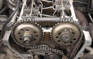 Close-up of engine timing chain and cam gears