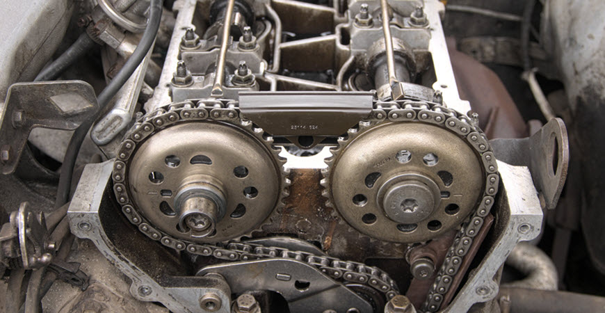 Close-up of engine timing chain and cam gears