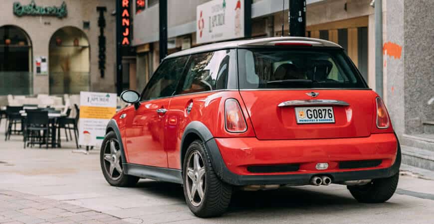 Red Mini Cooper parked on city street