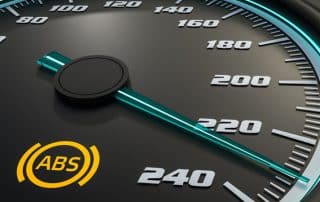 Car speedometer with illuminated ABS warning light