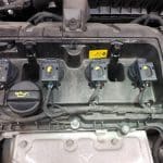Car engine with four ignition coils visible