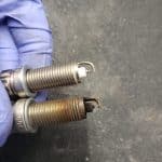 New and used spark plugs side by side