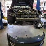 Car on lift with front bumper removed