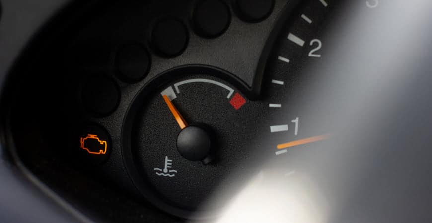 Car dashboard with check engine warning light