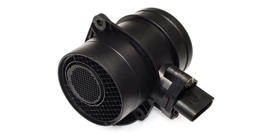 Black automotive mass airflow sensor on white background