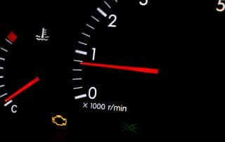 Car dashboard with check engine warning light