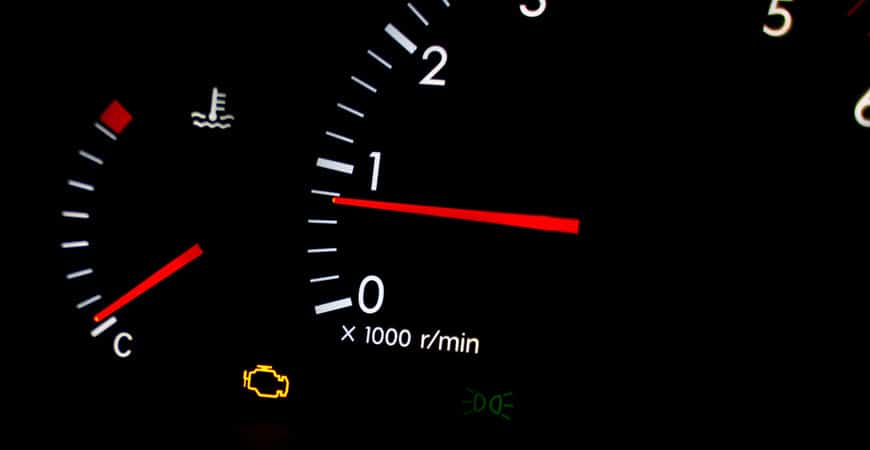 Car dashboard with check engine warning light