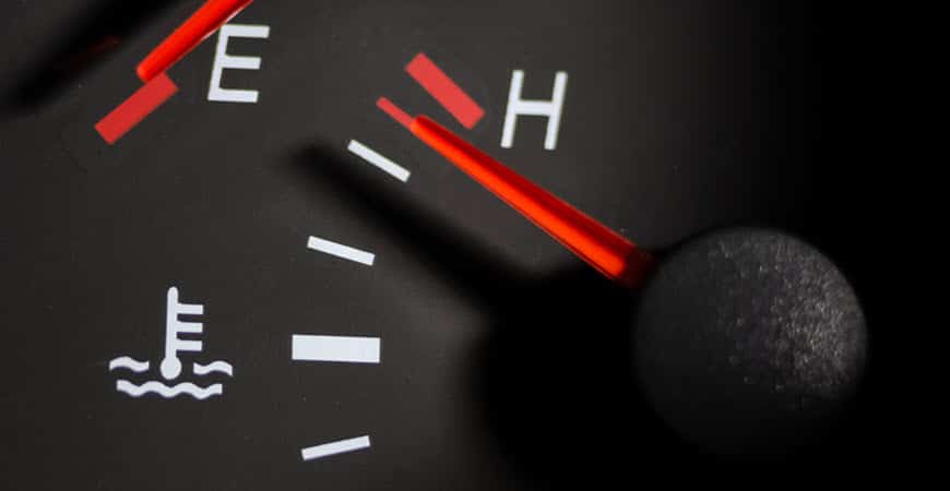 Car temperature gauge needle near hot mark