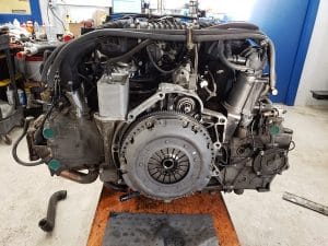 Car engine on stand in workshop