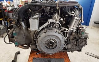 Car engine on stand in workshop