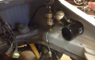 Car engine bay with fuel pump and filter