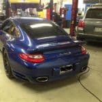 Blue Porsche 911 Turbo S in auto shop