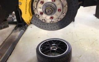 Porsche brake rotor and caliper with wheels