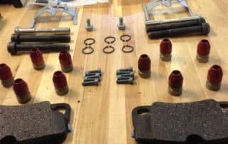 Brake components laid out on workshop table
