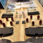 Brake components and hardware arranged on workbench
