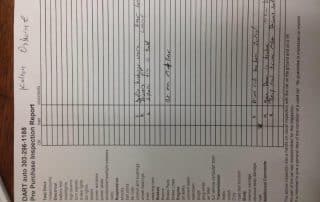 Pre-purchase vehicle inspection report with handwritten notes