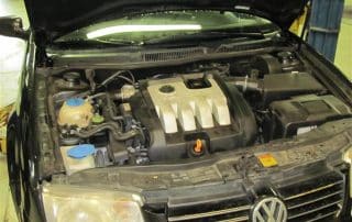 Open Volkswagen hood showing engine compartment